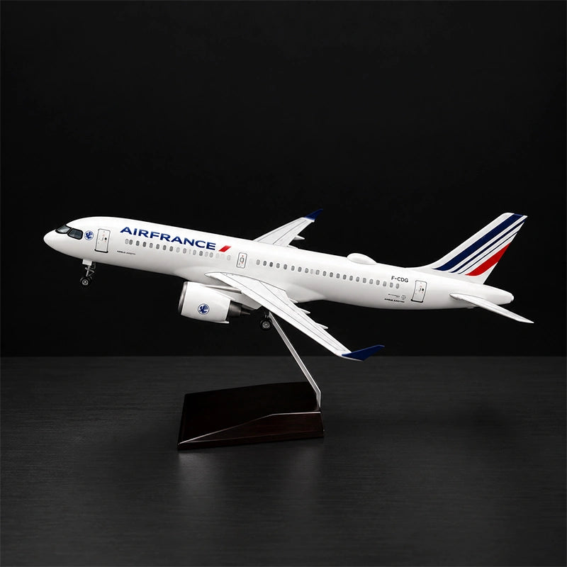 Air France Airbus A220-300 1:100 scale model airplane with detailed livery and display stand.