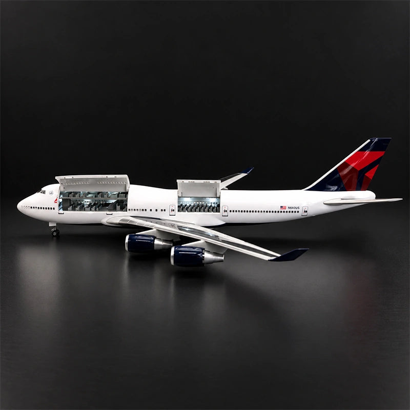 Delta Boeing 747 1:150 scale model airplane with open cabin interior and white LED lighting on a display stand.