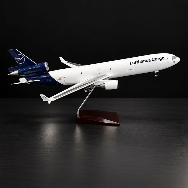 Lufthansa Cargo MD-11F 1:130 scale model airplane with three-engine cargo design and display stand.