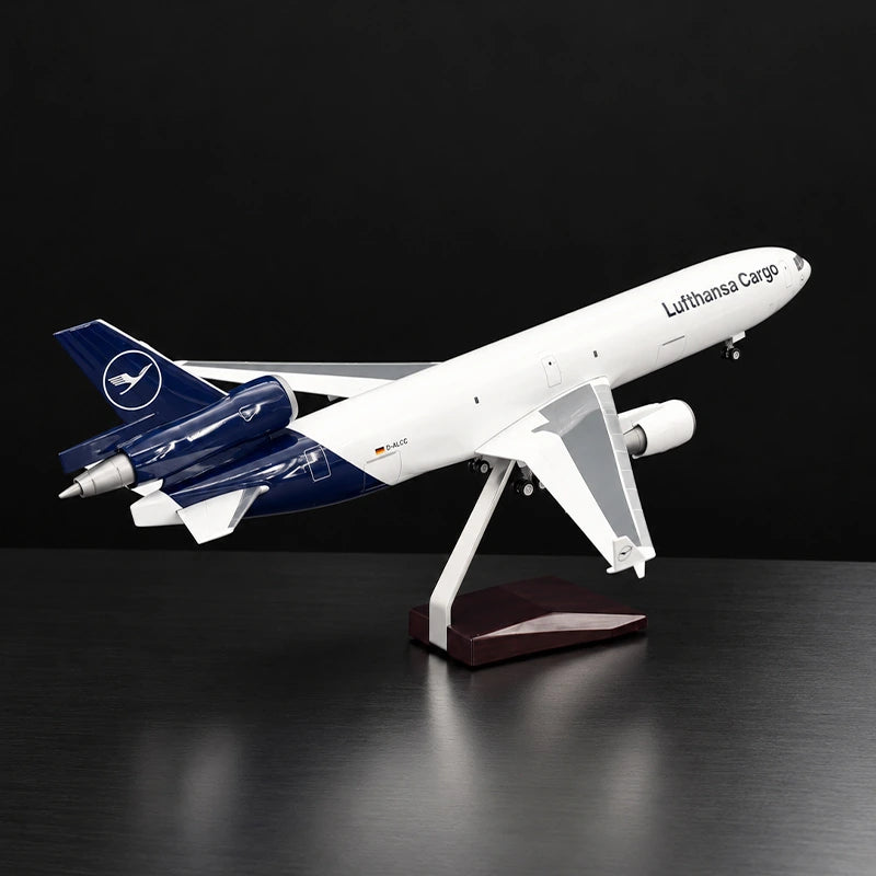 Lufthansa Cargo MD-11F 1:130 scale model airplane with three-engine cargo design and display stand.
