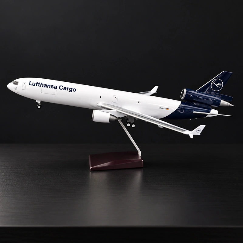 Lufthansa Cargo MD-11F 1:130 scale model airplane with three-engine cargo design and display stand.