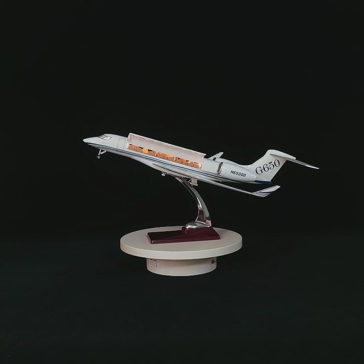 Load video: 1:50 scale Gulfstream G650 private jet model with openable cabin doors and luxury interior detail on a solid wood base by xairmodel